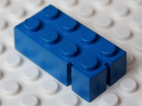 Lego Brick 2 x 4 without Bottom Tubes, Slotted (with 2 slots, near corner left)
