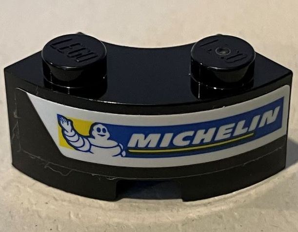 Lego Brick, Round Corner 2 x 2 Macaroni with Stud Notch and Reinforced Underside with Michelin Logo on White Stripe Pattern Model Left Side (Sticker) - Set 75881 / Black