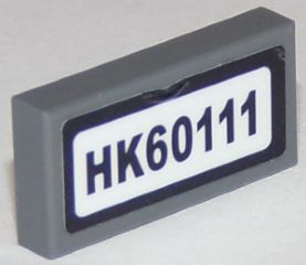 Lego Tile 1 x 2 with Black 'HK60111' Pattern (Sticker) - Set 60111 / Dark Bluish Gray