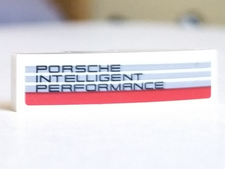 Lego Slope, Curved 4 x 1 with 'PORSCHE INTELLIGENT PERFORMANCE' Pattern Model Left Side (Sticker) - Set 75887 / White