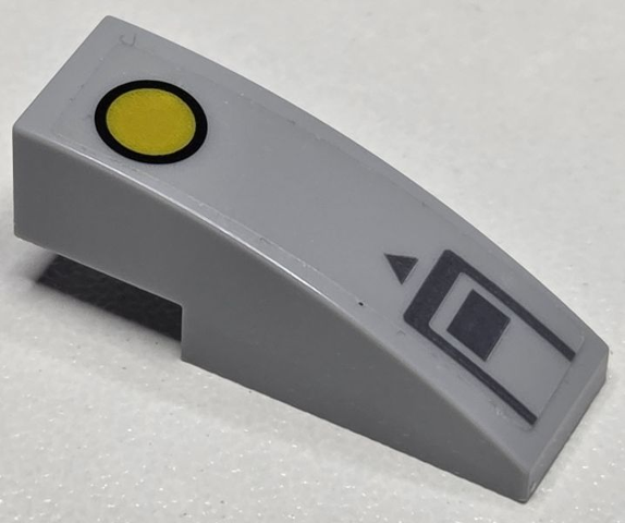 Lego Slope, Curved 3 x 1 with Yellow Circle with Black Outline, Dark Bluish Gray Triangle and Rectangle Pattern (Sticker) - Set 76232 / Light Bluish Gray