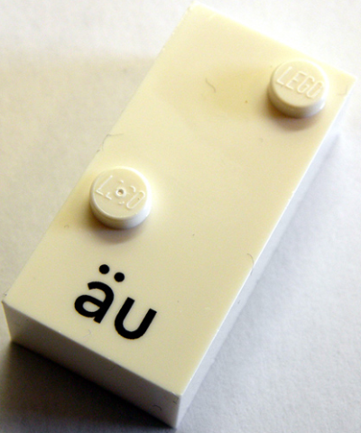 Lego Braille Brick 2 x 4 with 2 Studs ⠌ and 'äu' Print