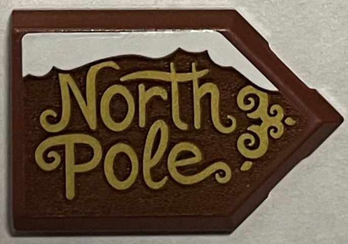Lego Tile, Modified 2 x 3 Pentagonal with Gold 'North Pole' and Snow Pattern (Sticker) - Set 40484 / Reddish Brown