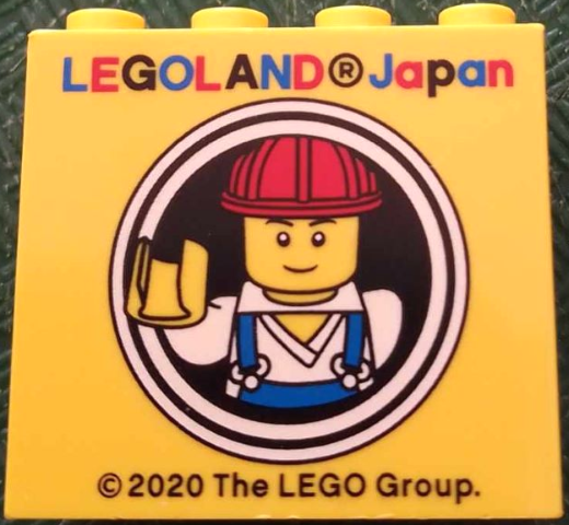 Lego Brick 2 x 4 x 3 with LEGOLAND Japan and Male Construction Worker Minifigure with Red Helmet in White Circles Pattern