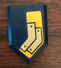 Lego Tile, Modified 2 x 3 Pentagonal with Gold Angled Plates with Rivets on Bright Light Orange Background Pattern Model Left Side (Sticker) - Set 72006 / Dark Blue