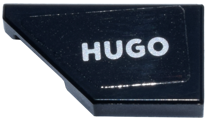 Lego Tile, Modified 1 x 2 Wedge Left with Silver 'HUGO' Logo Pattern (Sticker) - Set 77246