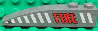 Lego Slope, Curved 6 x 1 with 2 Studs with Red 'FIRE' and White Stripes Pattern Model Right Side (Sticker) - Set 7043 / Dark Bluish Gray