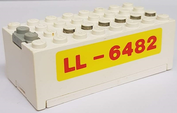 Lego Electric 9V Battery Box Small with Red 'LL-6482' on Yellow Background Pattern