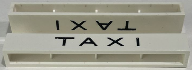 Lego Brick 1 x 8 without Bottom Tubes with Cross Side Supports with Black 'TAXI' Sans-Serif Thin Pattern