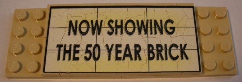 Lego Stickered Assembly 12 x 4 x 2/3 with 'NOW SHOWING THE 50 YEAR BRICK' Pattern (Sticker) - Set 10184