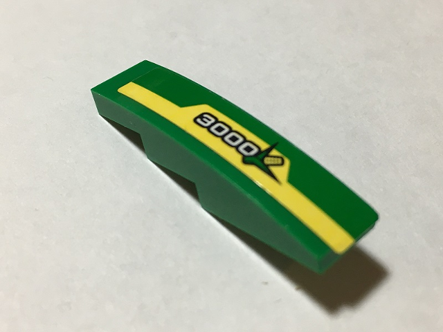 Lego Slope, Curved 4 x 1 with Yellow Stripe, White '3000' and Ear of Corn Pattern Model Right Side (Sticker) - Set 60223