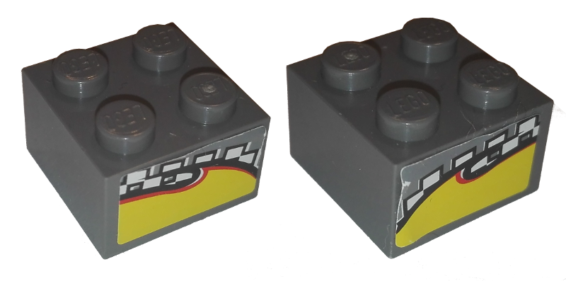 Lego Brick 2 x 2 with Yellow Flame on Checkered Background Pattern on Opposite Sides (Stickers) - Set 8134 / Dark Bluish Gray