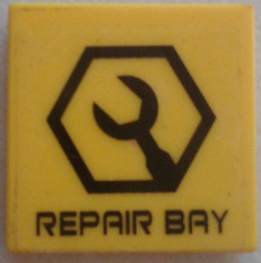 Lego Tile 2 x 2 with Black Wrench in Hexagon and 'REPAIR BAY' Pattern (Sticker) - Set 7709 / Yellow