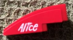 Lego Slope, Curved 3 x 1 with White 'Alice' on Red Background Pattern Model Left Side (Sticker) - Set 8142-2