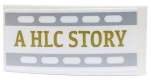 Lego Slope, Curved 4 x 2 with Gold 'A HLC STORY' with Light Bluish Gray Filmstrip Edges Pattern Model Left Side (Sticker) - Set 41448