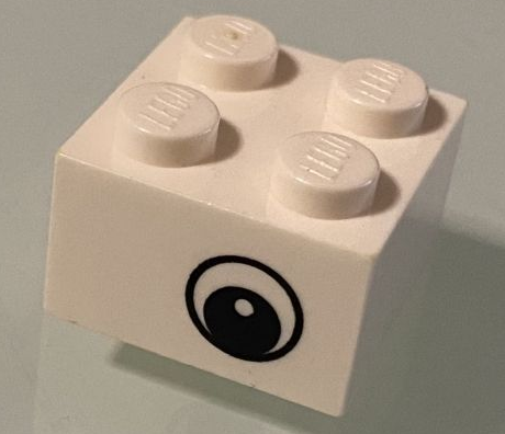Lego Brick 2 x 2 with Black and White Eye Offset with Dot in Pupil Pattern on Opposite Sides / White