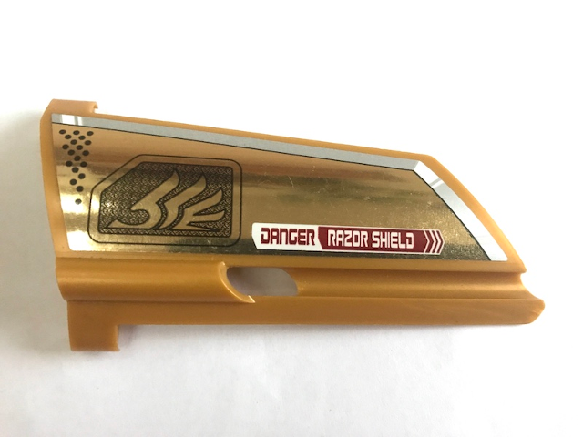 Lego Technic, Panel Fairing #21 Large Long, Small Hole, Side B with Quad Wing and 'DANGER RAZOR SHIELD' Pattern (Sticker) - Set 7714 / Pearl Gold