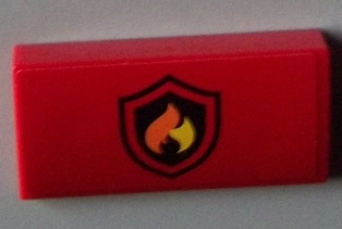 Lego Slope, Curved 2 x 4 x 2/3 with Bottom Tubes with Black and Yellow Fire Logo Badge Pattern (Sticker) - Set 60003