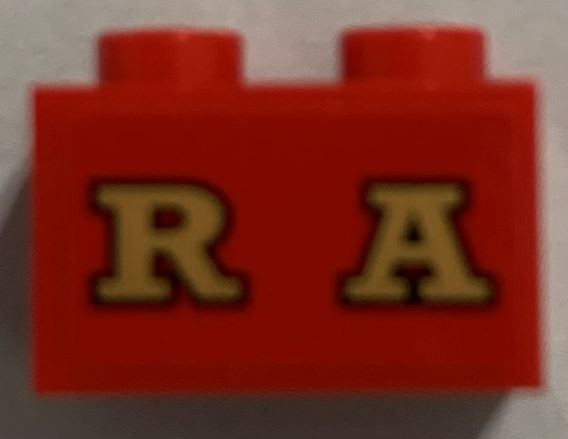 Lego Brick 1 x 2 with Gold 'RA' (RAILROAD) on Red Background Pattern (Sticker) - Set 71044
