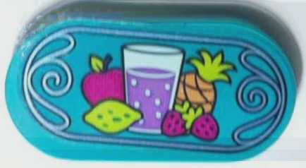 Lego Tile, Round 2 x 4 Oval with Fruit, Glass of Juice and Metallic Light Blue Scrollwork Border Pattern (Sticker) - Set 43215