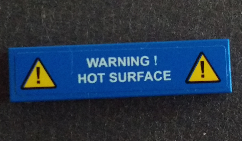Lego Tile 1 x 4 with Exclamation Mark in Warning Triangle and 'WARNING! HOT SURFACE' Pattern (Sticker) - Set 42042 / Blue