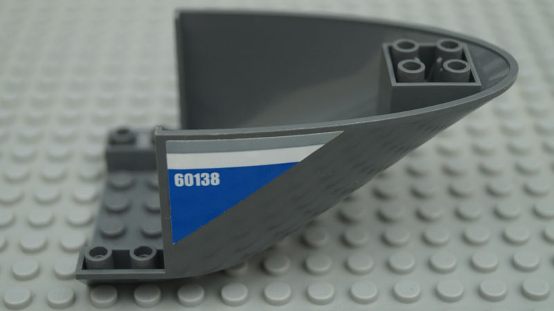 Lego Aircraft Fuselage Aft Section Curved Bottom 6 x 10 with Gray and White Lines and '60138' on Blue Background Pattern on Both Sides (Stickers) - Set 60138 / Dark Bluish Gray