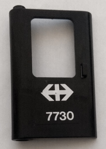 Lego Door 1 x 4 x 5 Train Left, Thin Support at Bottom with White Double Arrow (Swiss Federal Railways) and '7730' Pattern (Sticker) - Set 7730 / Black