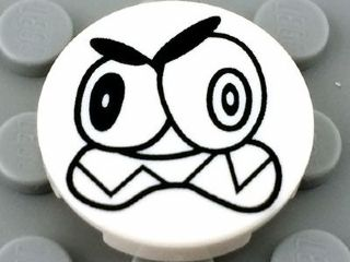 Lego Tile, Round 2 x 2 with Bottom Stud Holder with Black Large Eyes and Scowl with Sharp Teeth (Nixel Face) Pattern
