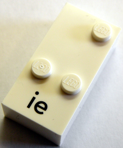 Lego Braille Brick 2 x 4 with 3 Studs ⠬ and 'ie' Print