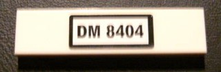 Lego Tile 1 x 4 with Black 'DM 8404' on White Background Pattern (Sticker) - Set 8404