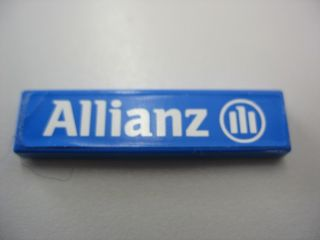 Lego Tile 1 x 4 with White Allianz Logo Pattern (Sticker) - Set 8461 / Blue