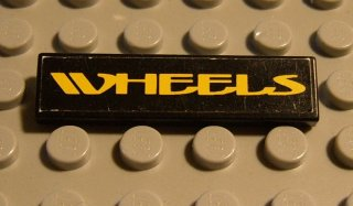 Lego Tile 1 x 4 with Yellow 'WHEELS' on Black Background Pattern (Sticker) - Set 8440 / Black