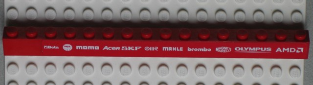 Lego Brick 1 x 16 with White 'Beta', 'NGK', 'MOMO', 'ACER', 'SKF', 'MAHLE', 'brembo', 'MAGNETI MARELLI', 'OLYMPUS' and 'AMD' Pattern (Sticker) - Set 8654 / Red