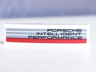 Lego Slope, Curved 4 x 1 with 'PORSCHE INTELLIGENT PERFORMANCE' Pattern Model Right Side (Sticker) - Set 75887 / White