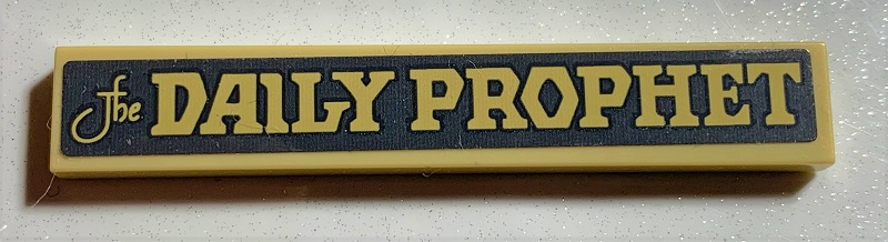 Lego Tile 1 x 6 with 'The DAILY PROPHET' on Dark Bluish Gray Background Pattern (Sticker) - Set 75978 / Tan