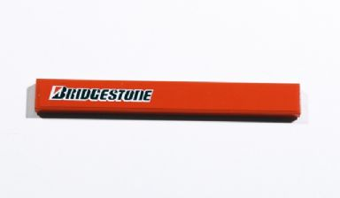 Lego Tile 1 x 8 with 'BRIDGESTONE' Pattern on Left (Sticker) - Set 8674 / Red