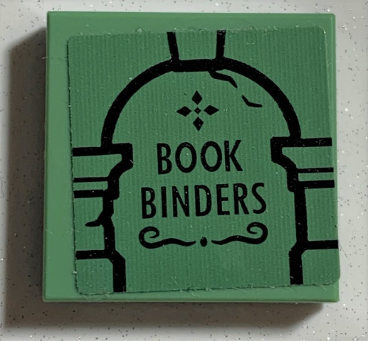 Lego Tile 2 x 2 with Black Archway and 'BOOK BINDERS' Pattern (Sticker) - Set 75978