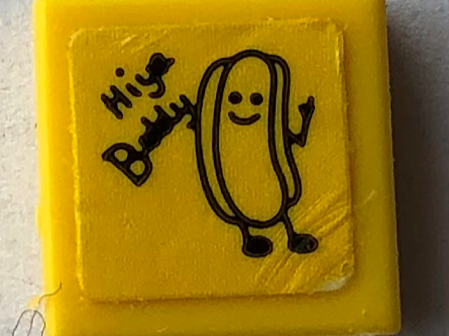 Lego Tile 1 x 1 with Black 'Hiya Buddy' and Hot Dog on Post-It Note Pattern (Sticker) - Set 21336 / Yellow