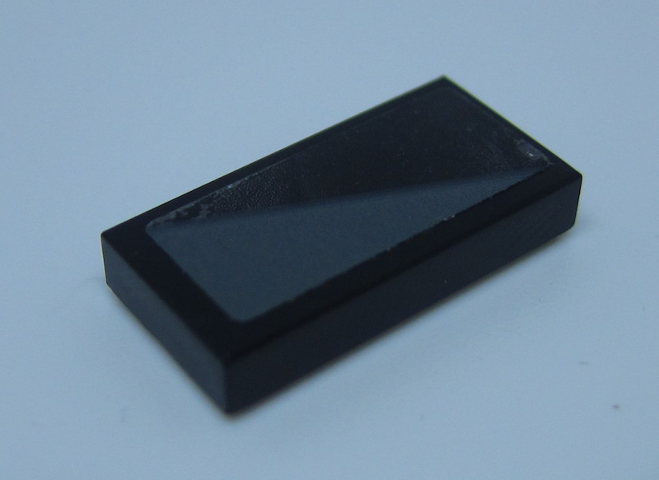 Lego Tile 1 x 2 with Dark Bluish Gray Triangle Pattern Model Left Side (Sticker) - Set 75892 / Black