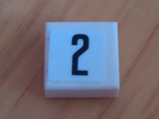 Lego Tile 1 x 1 with Black Number 2 Narrow on White Background Pattern (Sticker) - Set 8135 / White