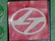 Lego Tile 2 x 2 with White Stylized 'TT' in Ellipse on Red Background Pattern (Sticker) - Set 8448 / Black