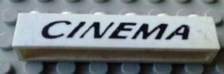 Lego Brick 1 x 6 without Bottom Tubes with Cross Side Supports with Black 'CINEMA' Italic Thin Pattern
