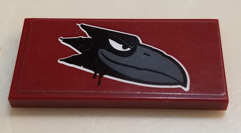 Lego Tile 2 x 4 with Black Raven Head on Dark Red Background Pattern Model Right Side (Sticker) - Set 60209 / Dark Red