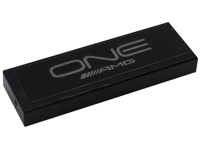 Lego Tile 1 x 3 with Silver 'ONE' and 'AMG' Logo Pattern (Sticker) - Set 76909 / Black