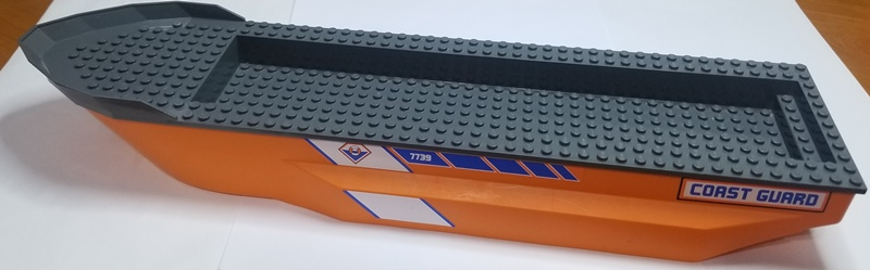 Lego Boat, Hull Unitary 51 x 12 x 6 with Side Bulges with Dark Bluish Gray Top with Coast Guard Logo and '7739' Pattern on Both Sides (Stickers) - Set 7739