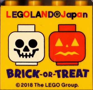 Lego Brick 2 x 4 x 3 with LEGOLAND Japan, 'BRICK-OR-TREAT', and Skeleton Skull and Jack O Lantern Minifigure Heads Pattern / Yellow