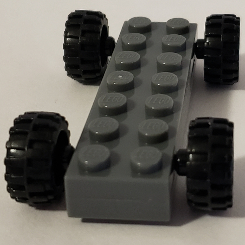 Lego Vehicle Base Fast Food Racer 2 x 7 x 2/3 with Black Wheels