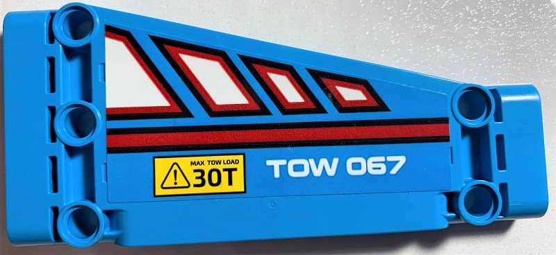 Lego Technic, Panel Plate 5 x 11 x 1 Tapered with White Polygons Outlined in Red, Red Line, 'TOW 067' and 'MAX TOW LOAD 30T' Pattern Model Left Side (Sticker) - Set 42070