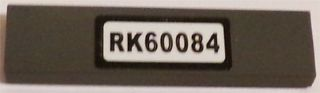 Lego Tile 1 x 4 with 'RK60084' Pattern (Sticker) - Set 60084 / Dark Bluish Gray