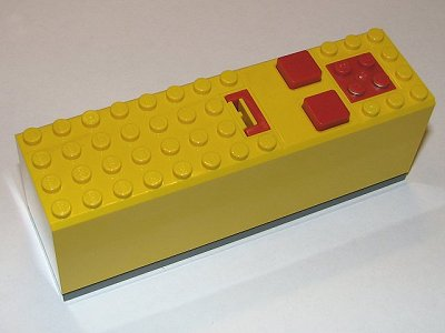 Lego Electric 9V Battery Box 4 x 14 x 4 with Red Buttons and Contact Plate with Dark Bluish Gray Base (2846 / 2847c00)